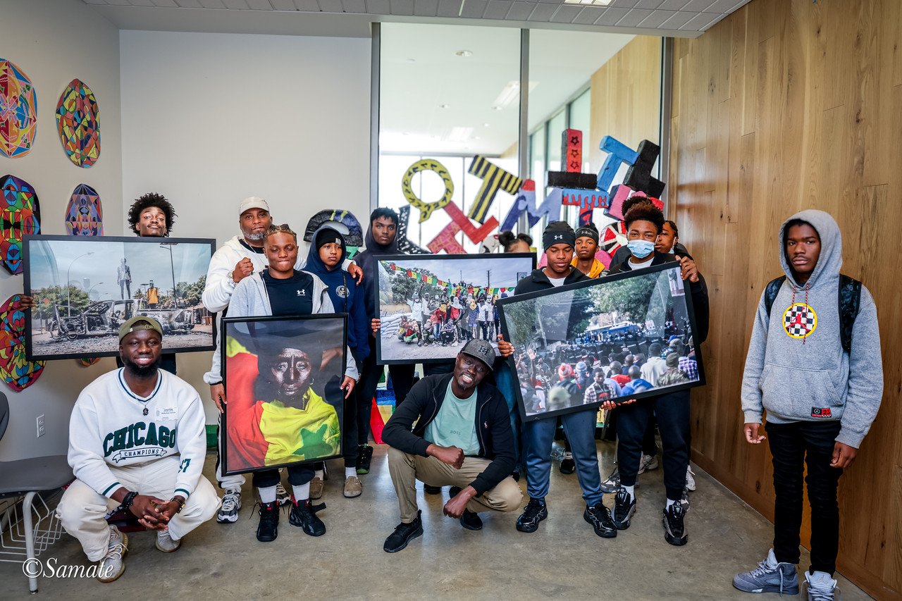 Group photo of the ARC Institute team with KIPP DC students and their artwork